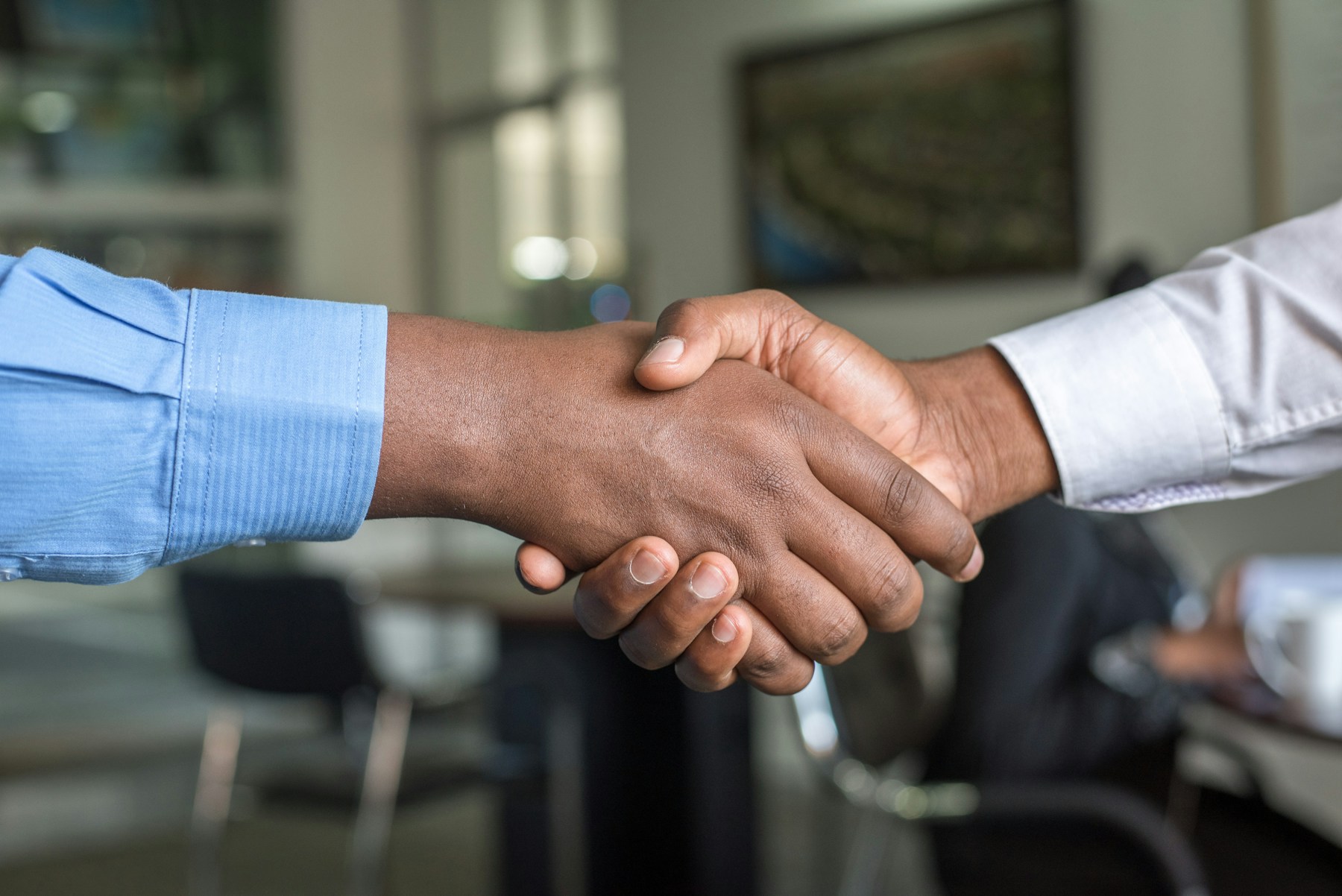 Handshake representing trusted advisory partnership